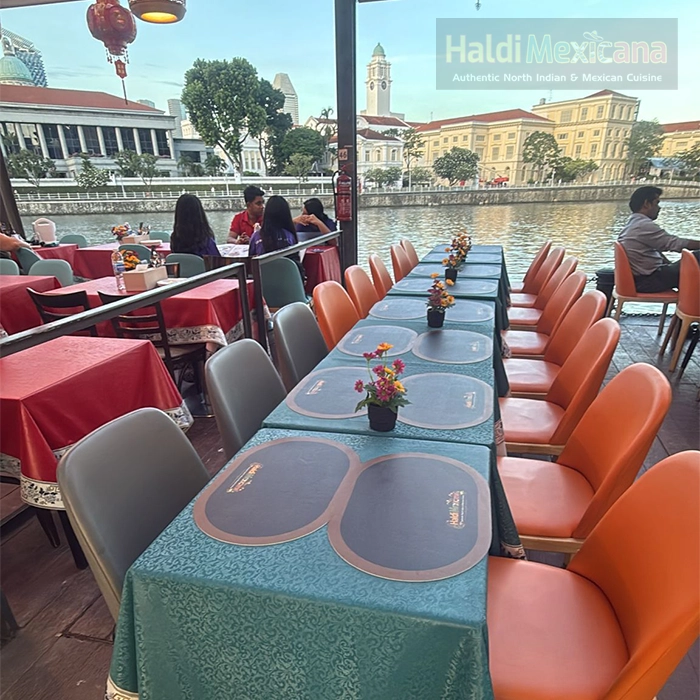 Night view of Haldi Mexicana storefront at boat quay indian restaurant near Singapore River